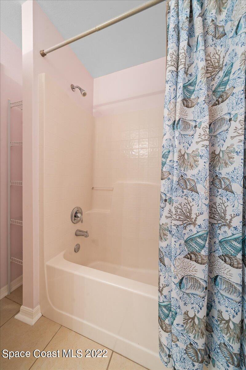 2177 Redwood Circle Palm Bay, FL 32905 - Photo 20 of 30 a bathroom with a bathtub and shower