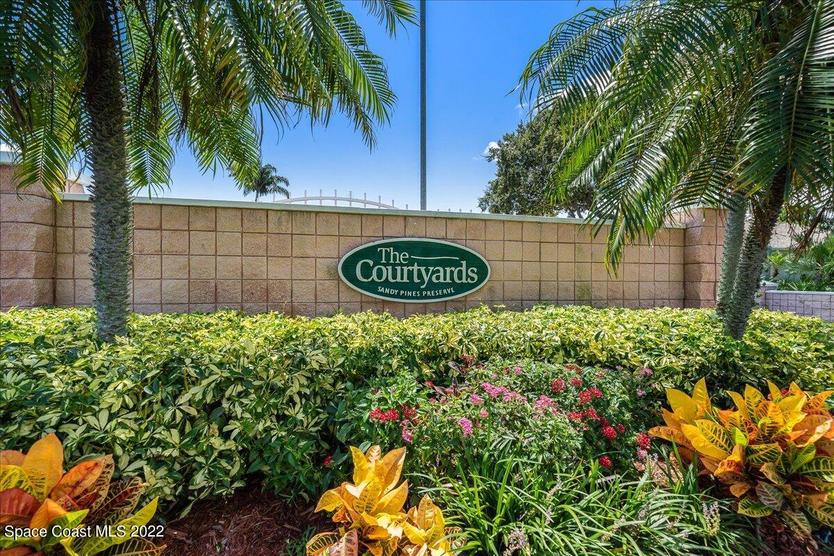 2177 Redwood Circle Palm Bay, FL 32905 - Photo 2 of 30 a view of a bunch of flowers and trees