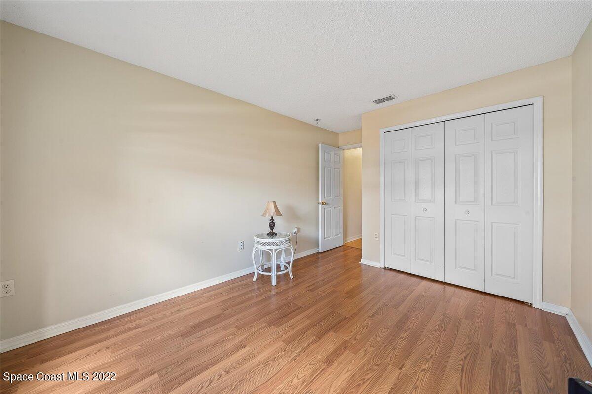 2177 Redwood Circle Palm Bay, FL 32905 - Photo 22 of 30 a view of empty room with wooden floor