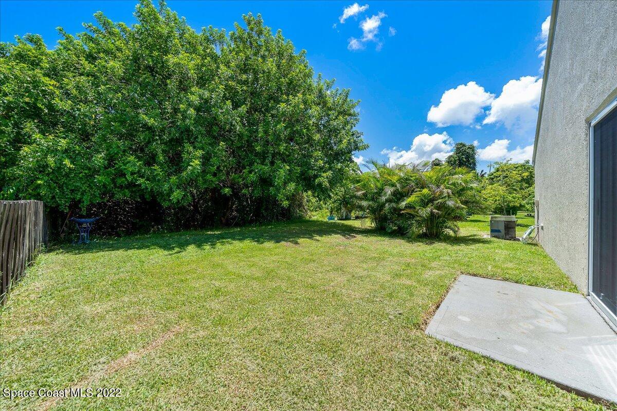 2177 Redwood Circle Palm Bay, FL 32905 - Photo 23 of 30 a view of a yard with an outdoor space