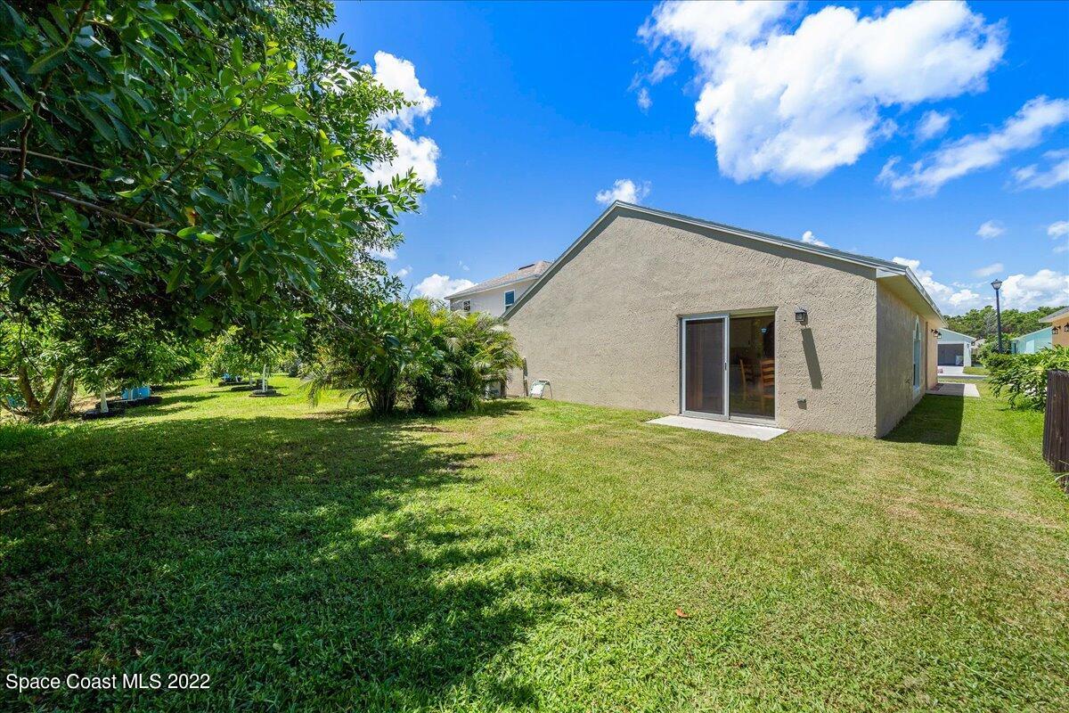 2177 Redwood Circle Palm Bay, FL 32905 - Photo 25 of 30 a front view of house with yard and green space