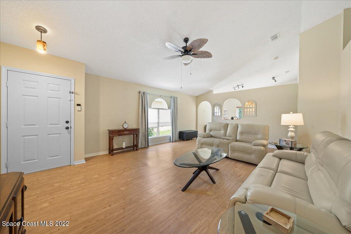 2177 Redwood Circle Palm Bay, FL 32905 - Photo 5 of 30 a living room with furniture and a table