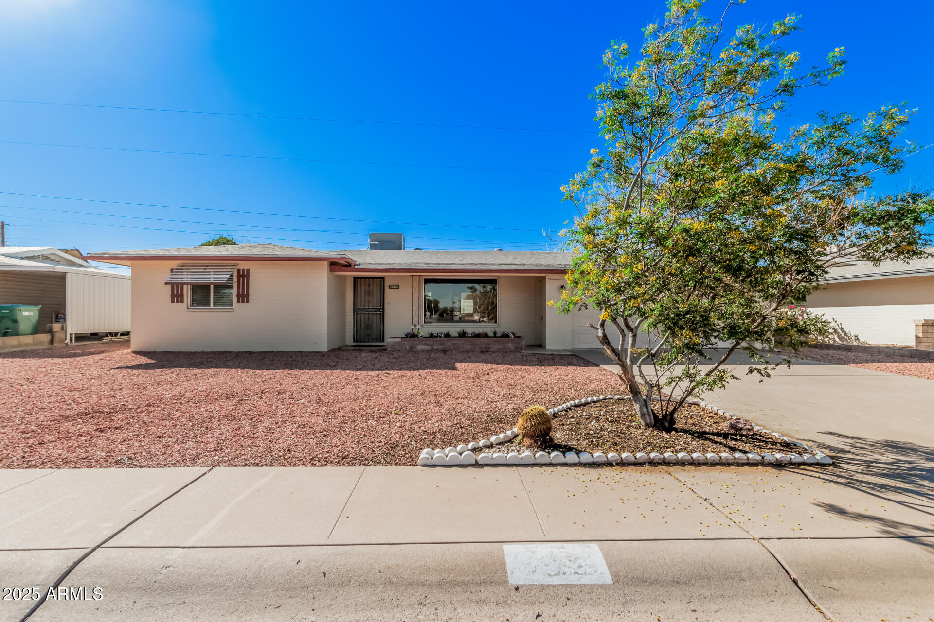 5533 East Decatur Street Mesa, AZ 85205 - Photo 1 of 29 a front view of a house with garden