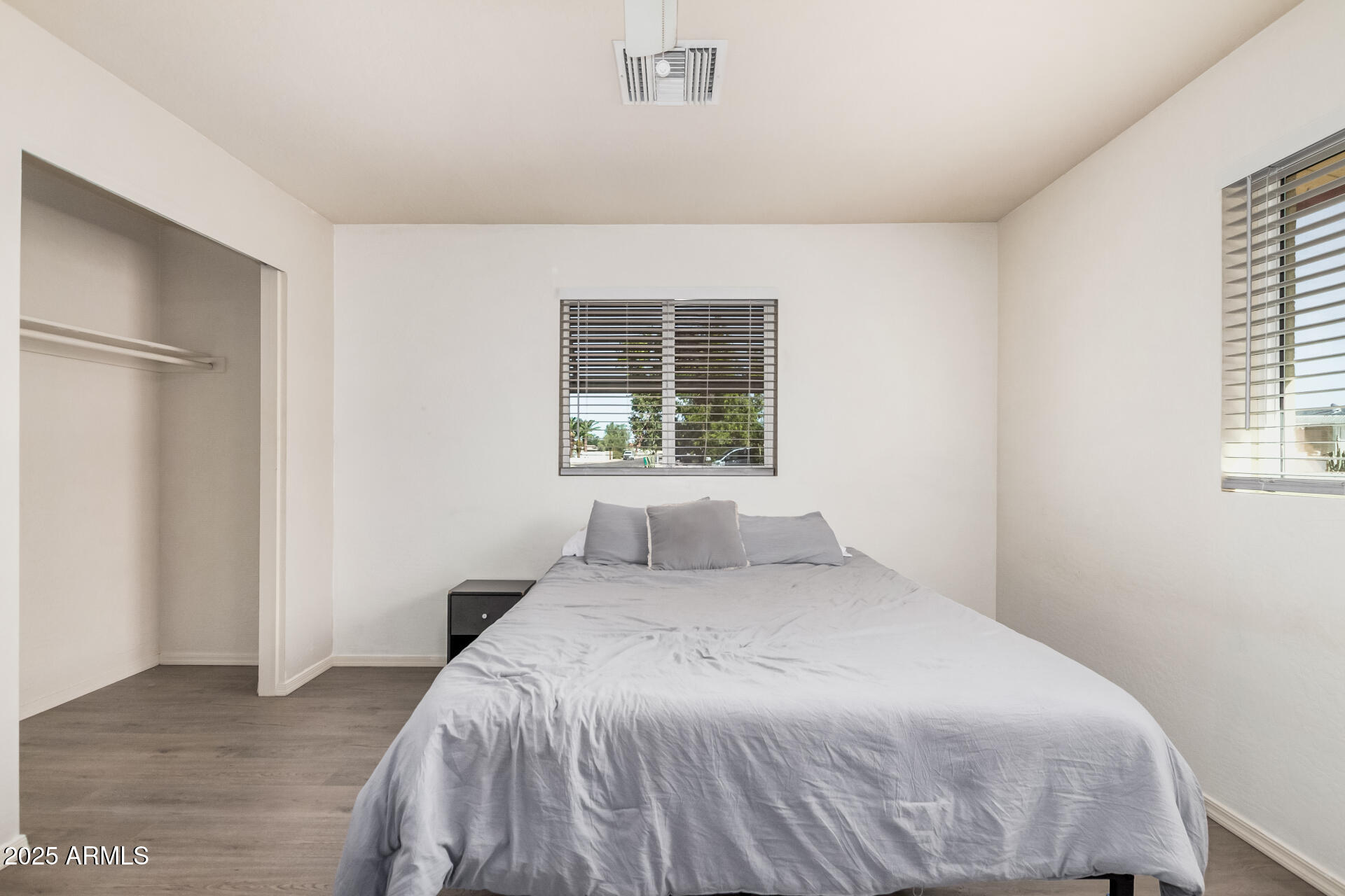 5533 East Decatur Street Mesa, AZ 85205 - Photo 12 of 29 a bedroom with a bed and a window