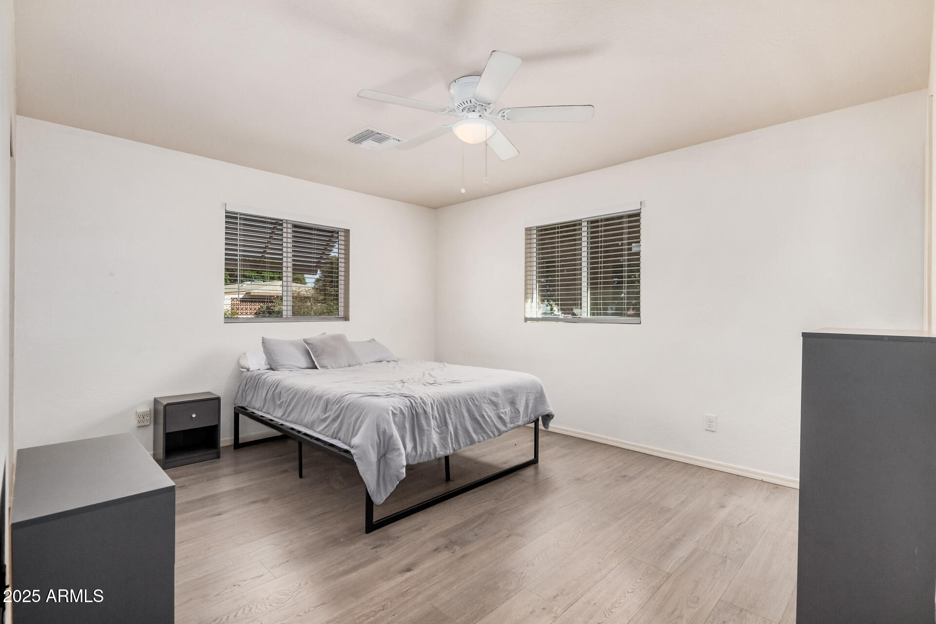 5533 East Decatur Street Mesa, AZ 85205 - Photo 13 of 29 a spacious bedroom with a bed and a window