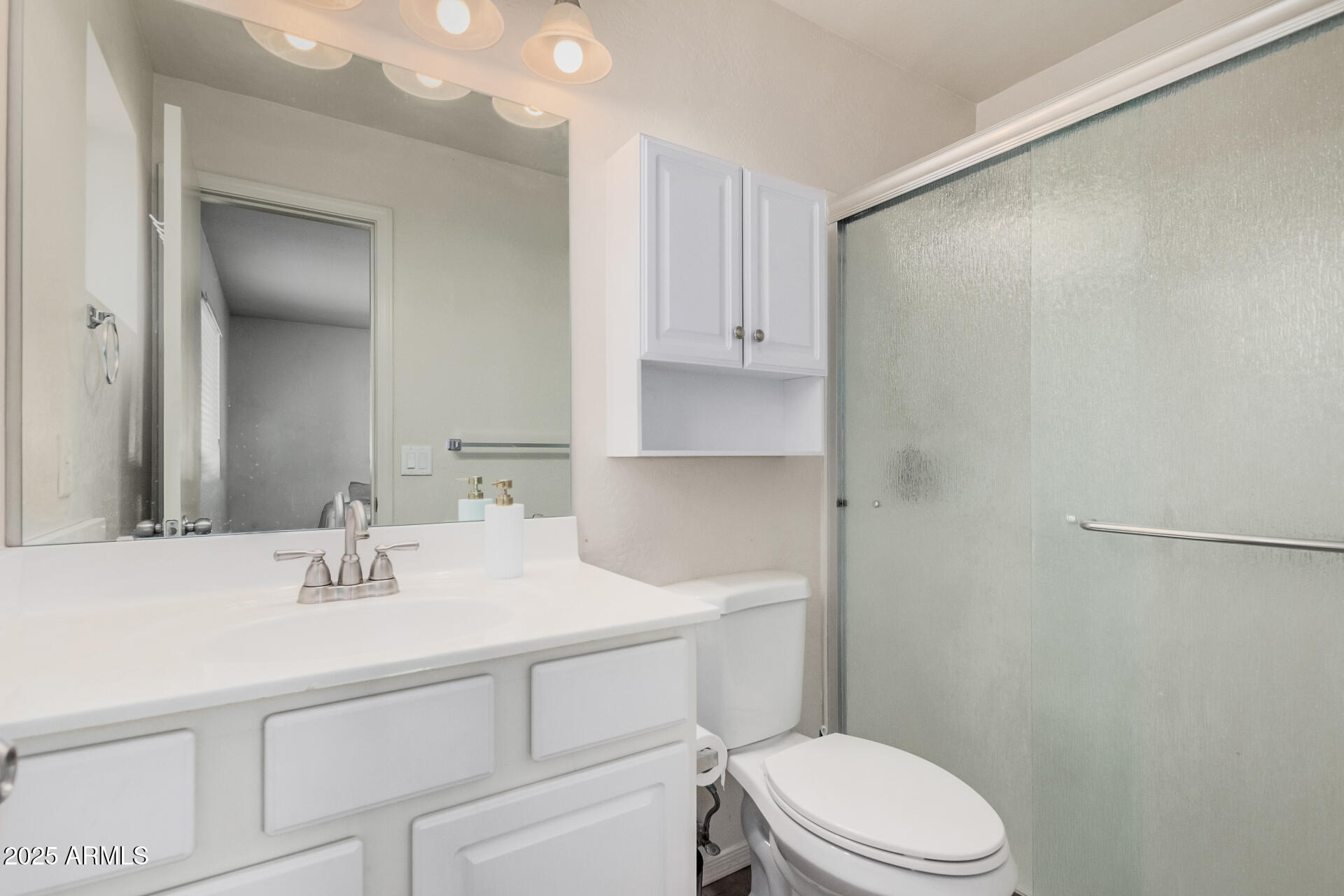 5533 East Decatur Street Mesa, AZ 85205 - Photo 14 of 29 a bathroom with a sink toilet vanity and tub