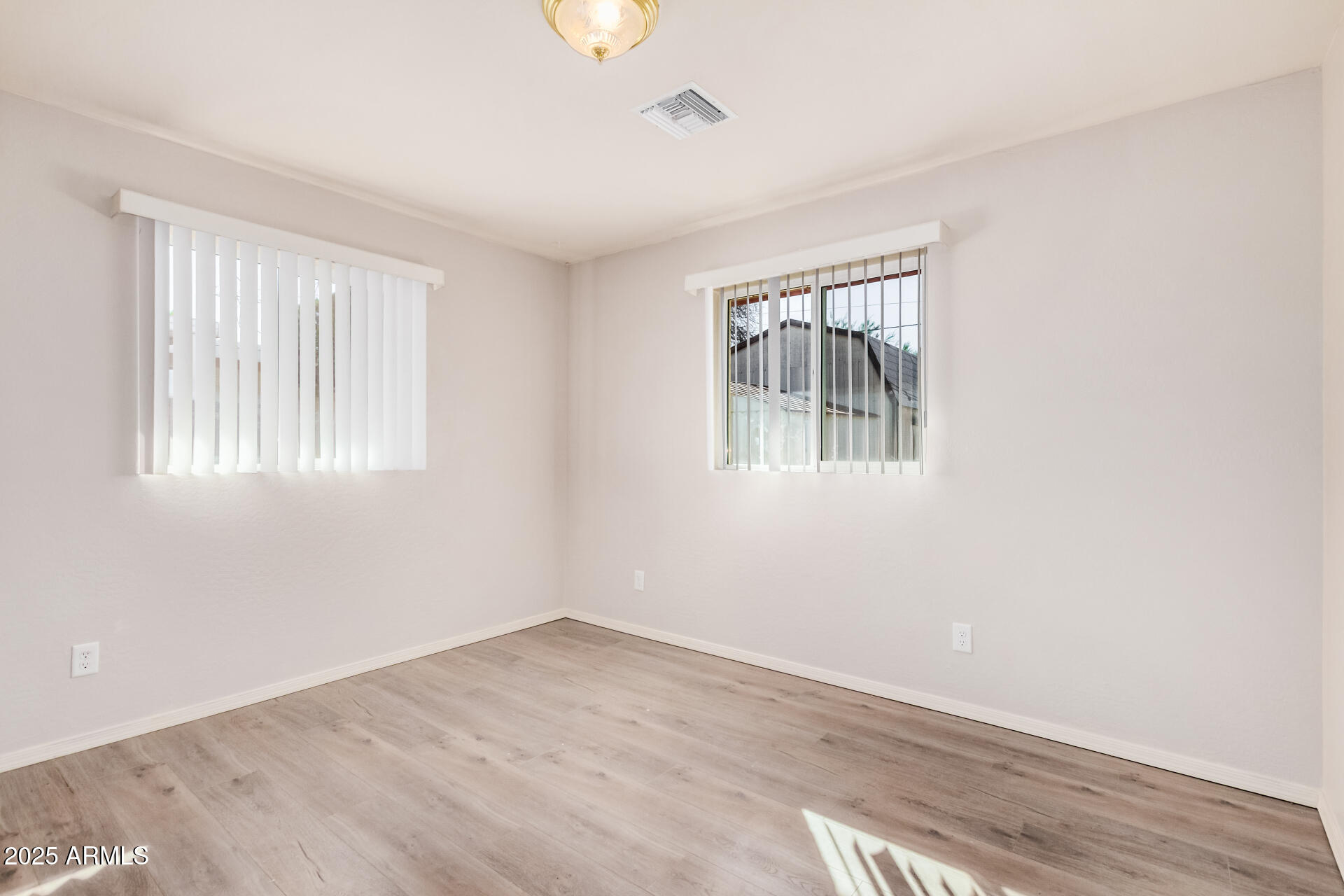 5533 East Decatur Street Mesa, AZ 85205 - Photo 15 of 29 an empty room with windows