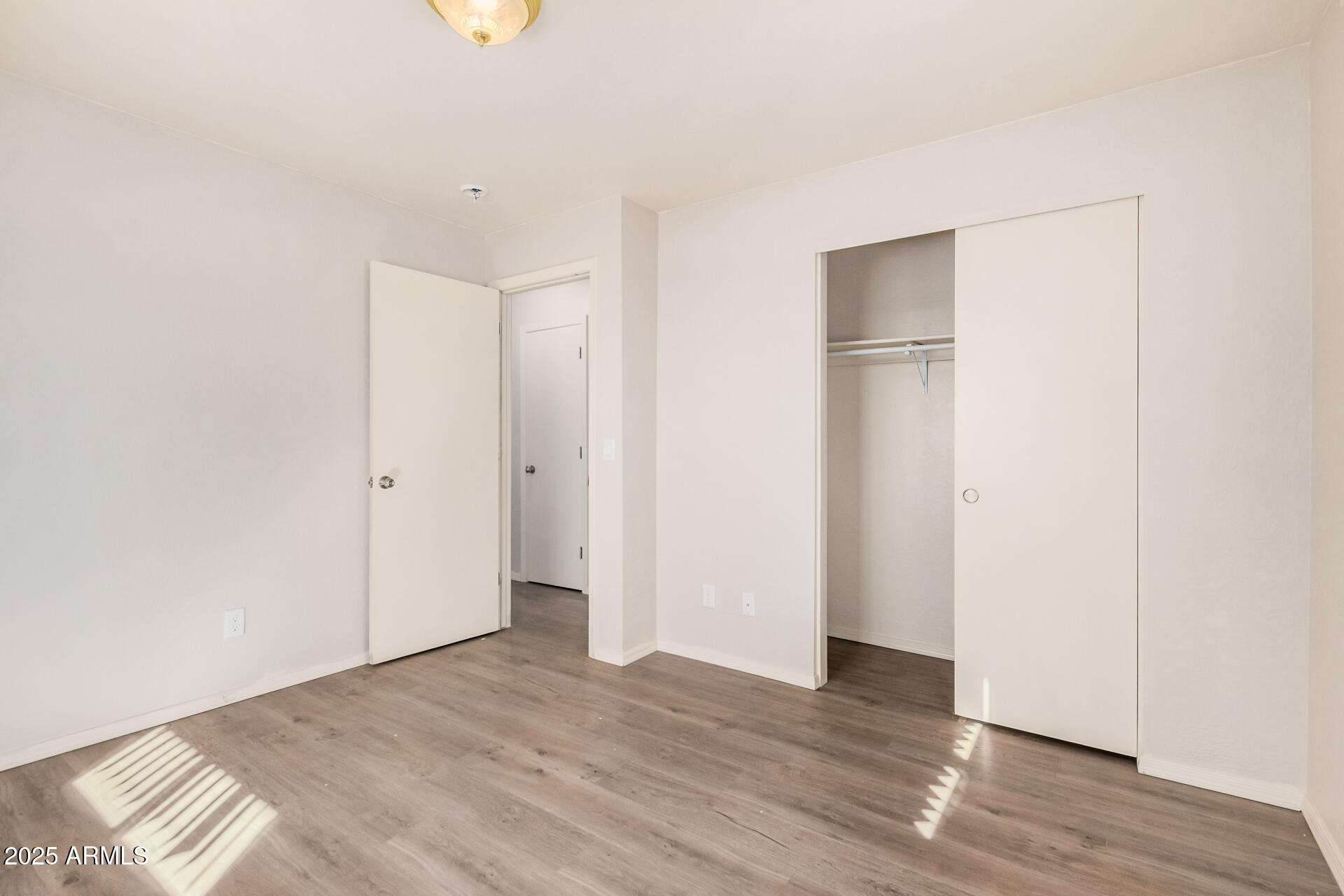 5533 East Decatur Street Mesa, AZ 85205 - Photo 16 of 29 a view of empty room with wooden floor