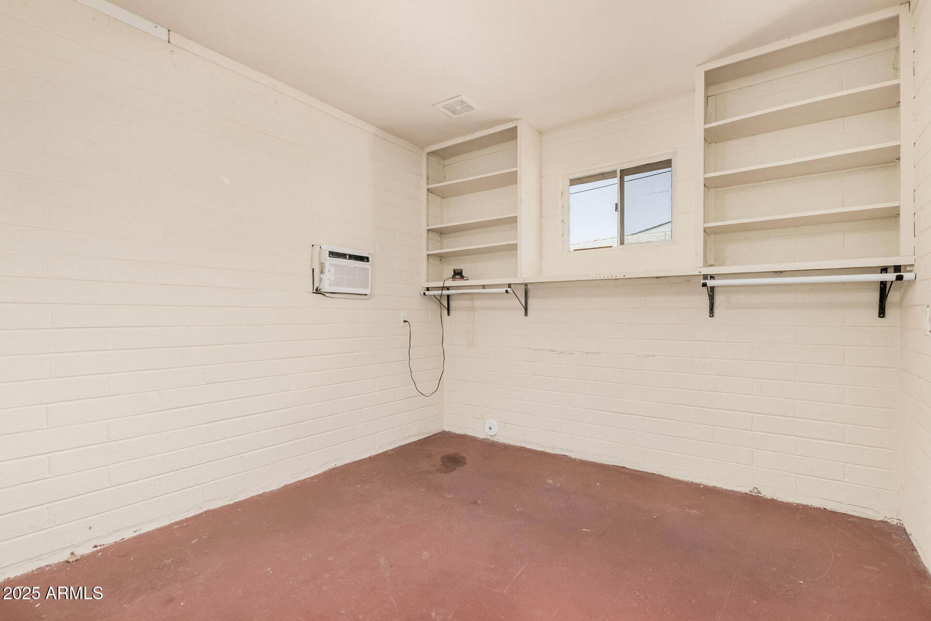 5533 East Decatur Street Mesa, AZ 85205 - Photo 20 of 29 a view of a room with racks on the wall