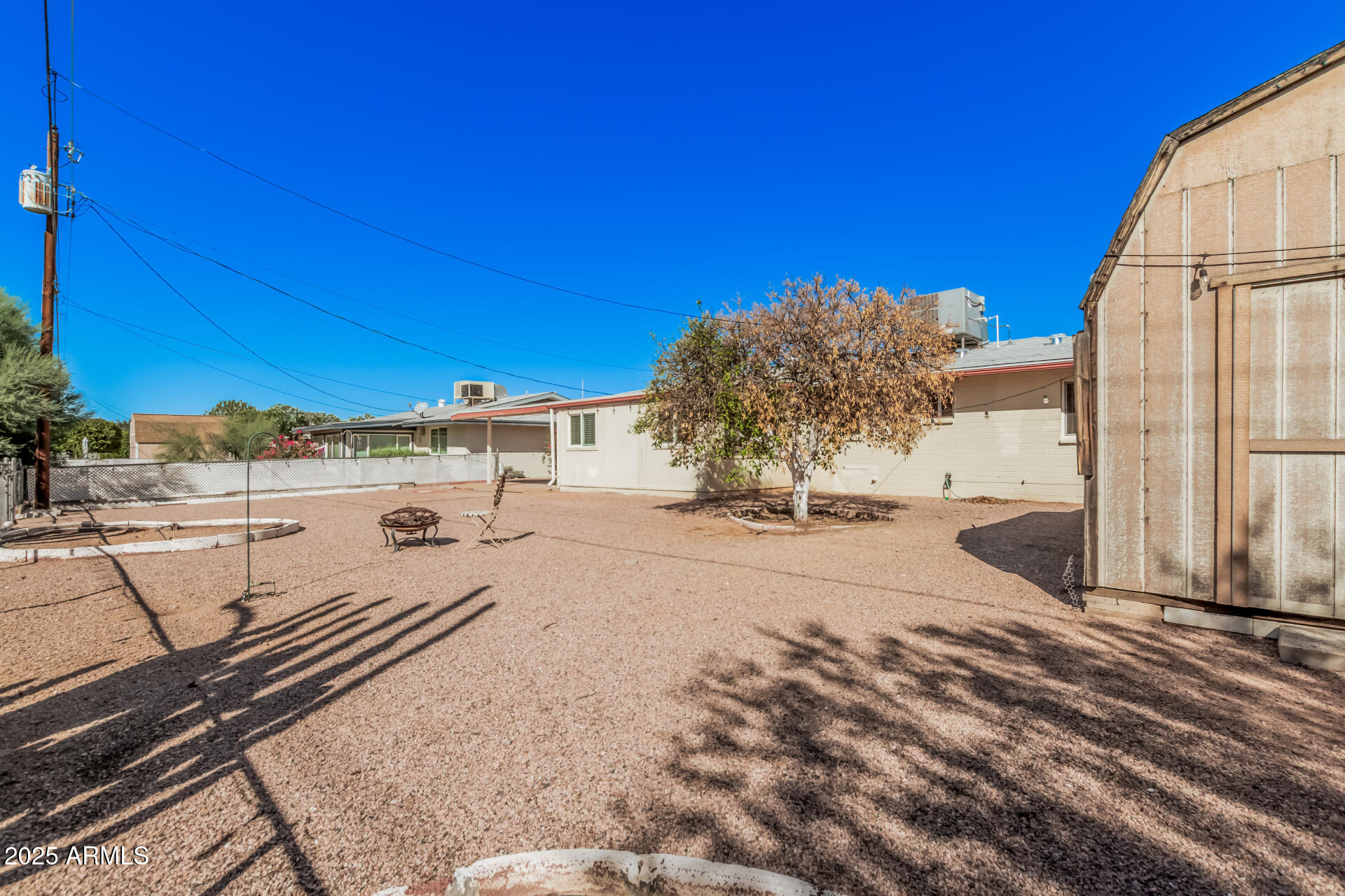 5533 East Decatur Street Mesa, AZ 85205 - Photo 24 of 29 a view of a terrace with wooden fence