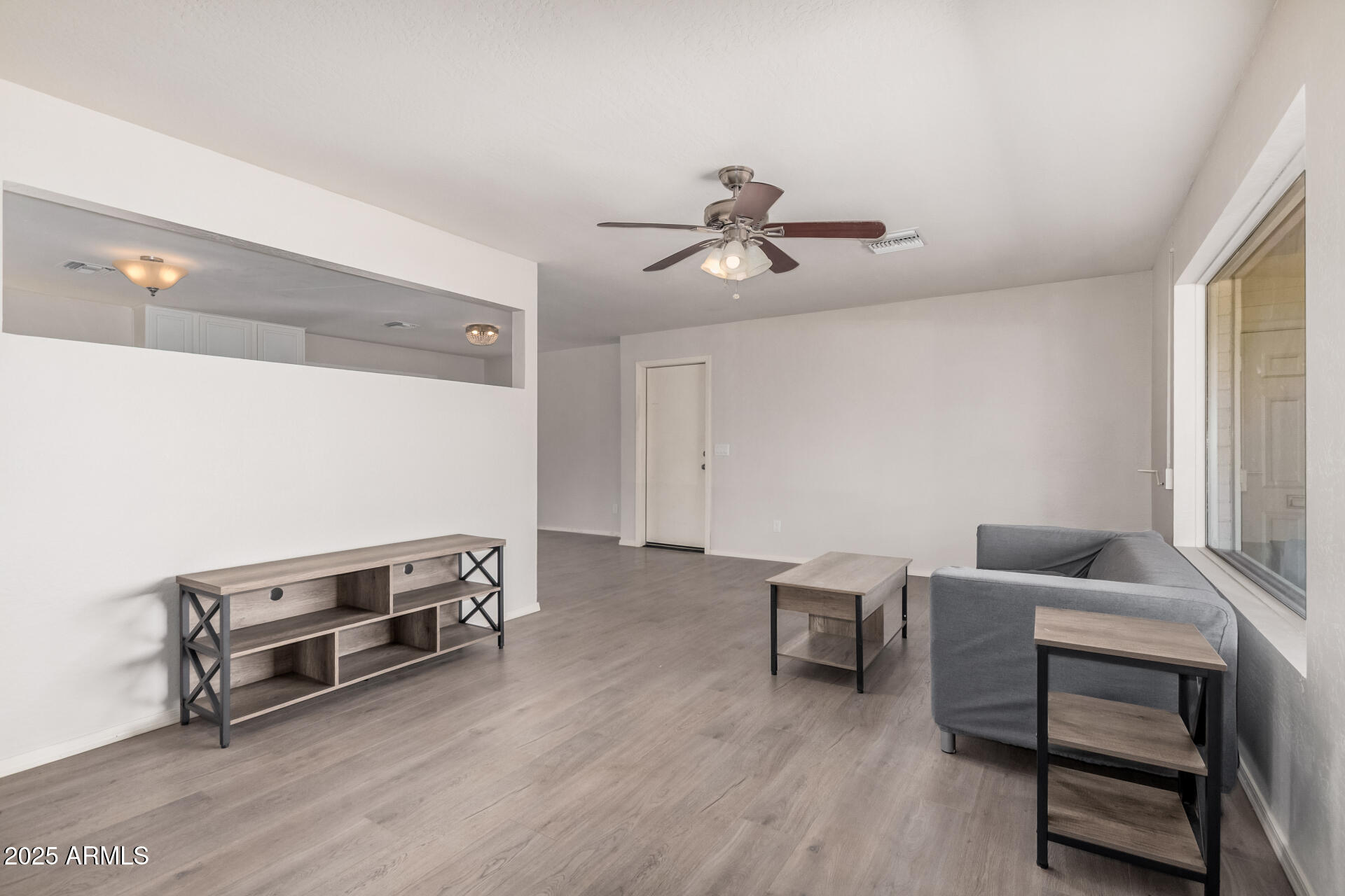 5533 East Decatur Street Mesa, AZ 85205 - Photo 4 of 29 a living room with furniture and a wooden floor