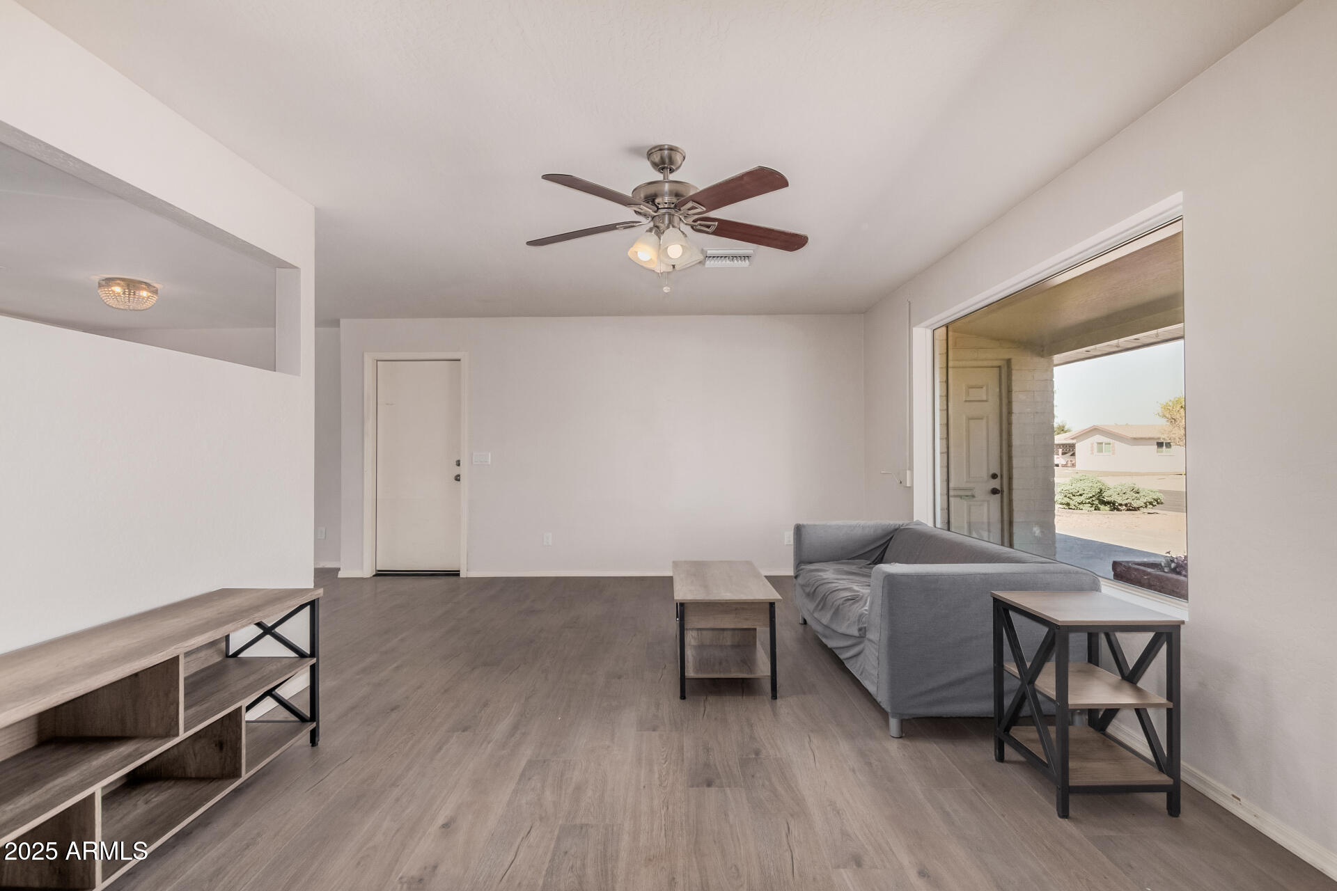 5533 East Decatur Street Mesa, AZ 85205 - Photo 5 of 29 a living room with furniture and a window