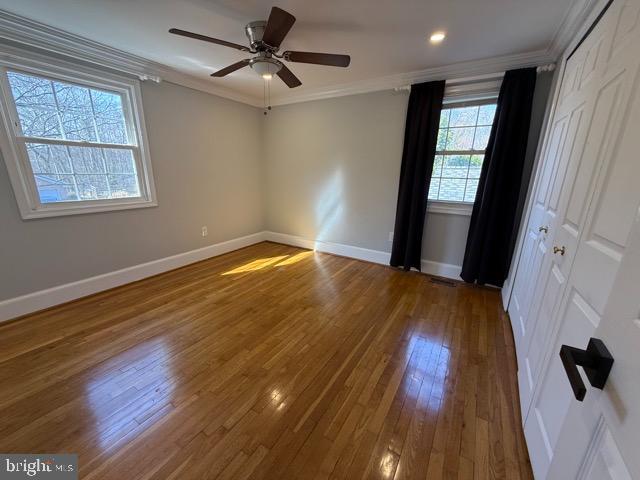 3409 Beret Lane Silver Spring, MD 20906 - Photo 14 of 18 a view of an empty room with wooden floor and a window