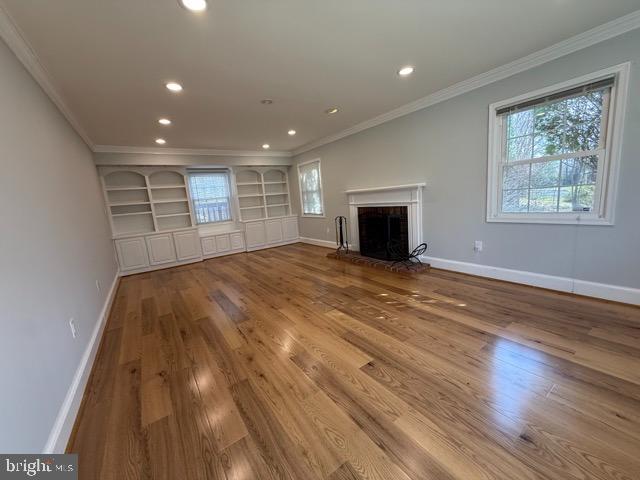 3409 Beret Lane Silver Spring, MD 20906 - Photo 3 of 18 a view of empty room with wooden floor and fireplace