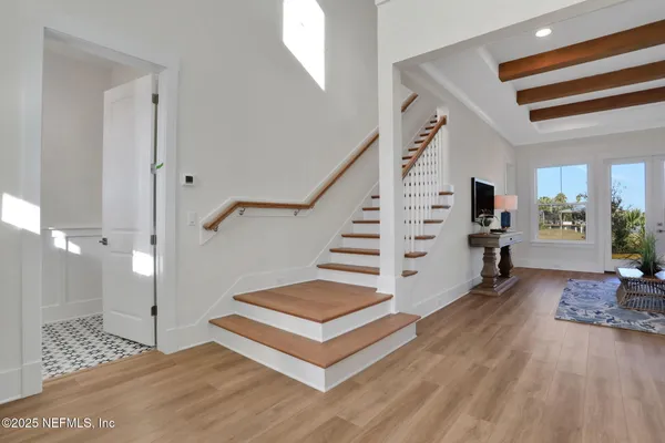 a kitchen with a sink a stove and cabinets