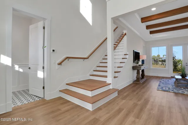 a kitchen with a sink a stove and cabinets