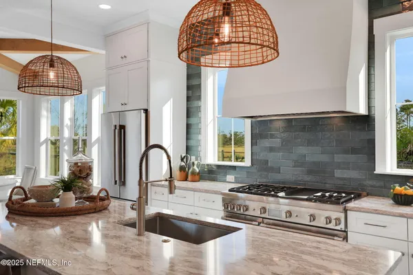 a spacious bedroom with a bed and a table