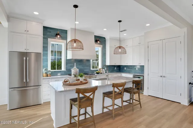 a bedroom with a bed and a chandelier fan