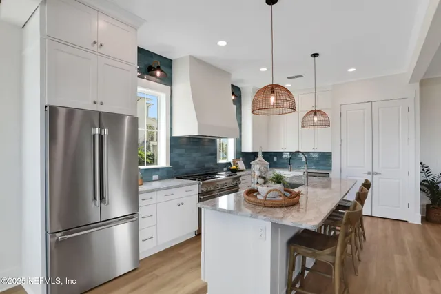 a bedroom with a bed and a potted plant