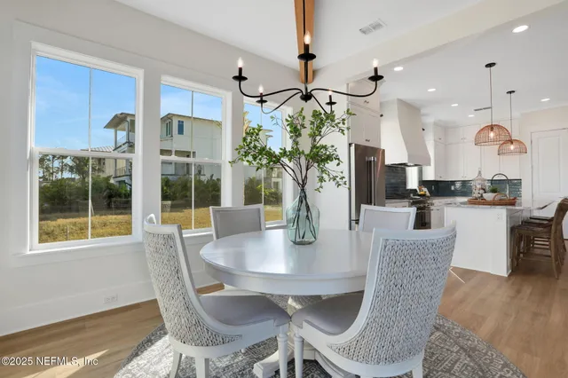 a view of a hallway with wooden floor and a couch