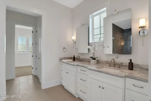 a spacious bedroom with a bed and a large window