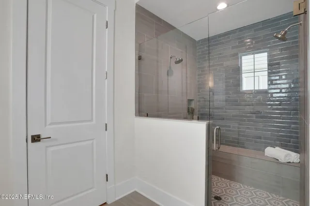 a bedroom with a bed and a potted plant