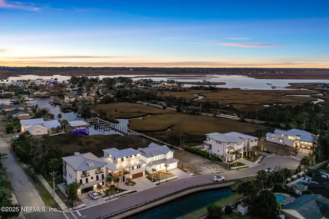 a view of an entryway with wooden floor and door