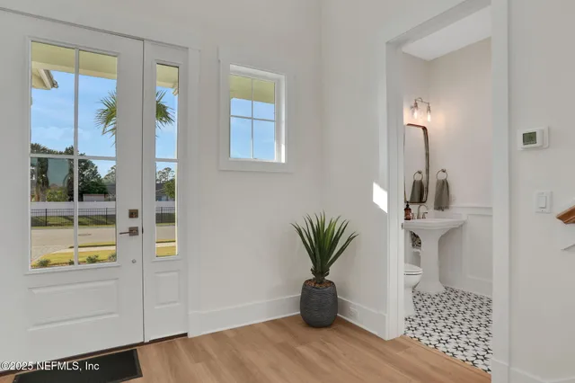 a living room with furniture wooden floor and a flat screen tv