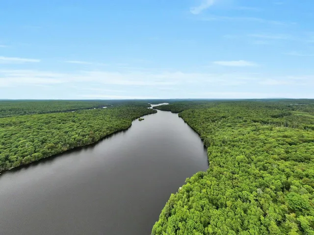 a view of a lake with a big yard