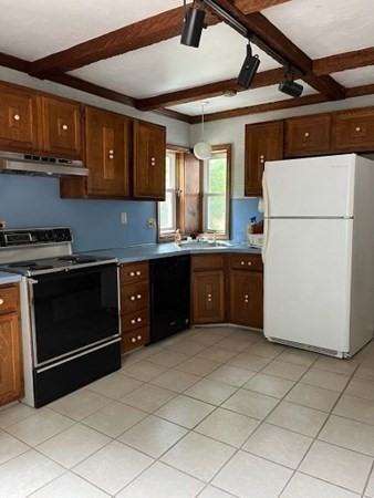 656 Franklin Street, Unit 656 Wrentham, MA 02093 - Photo 7 of 11 a kitchen with a cabinets and white appliances