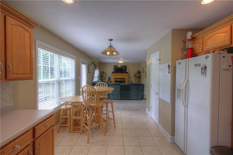 108 Chestnut Ridge Drive Beaver Falls, PA 15010 - Photo 6 of 25 Kitchen to Family Room view. Crisp and clean. The rear wall of windows & doors lets plentiful natural light shine through.