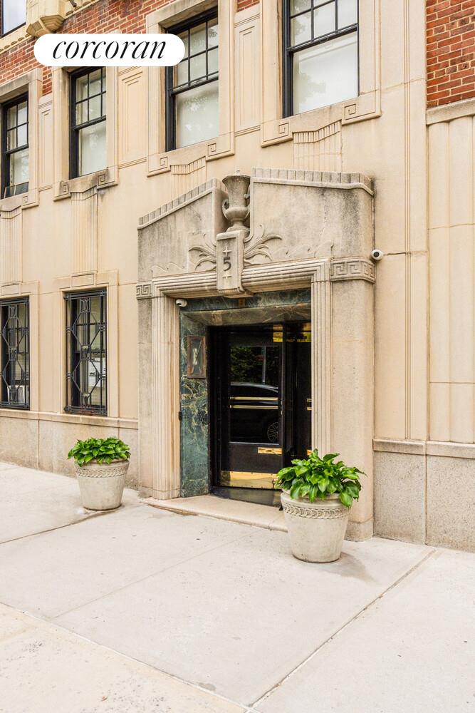 5 Riverside Drive, Unit 5A Manhattan, NY 10023 - Photo 10 of 13 a front view of a building with potted plants