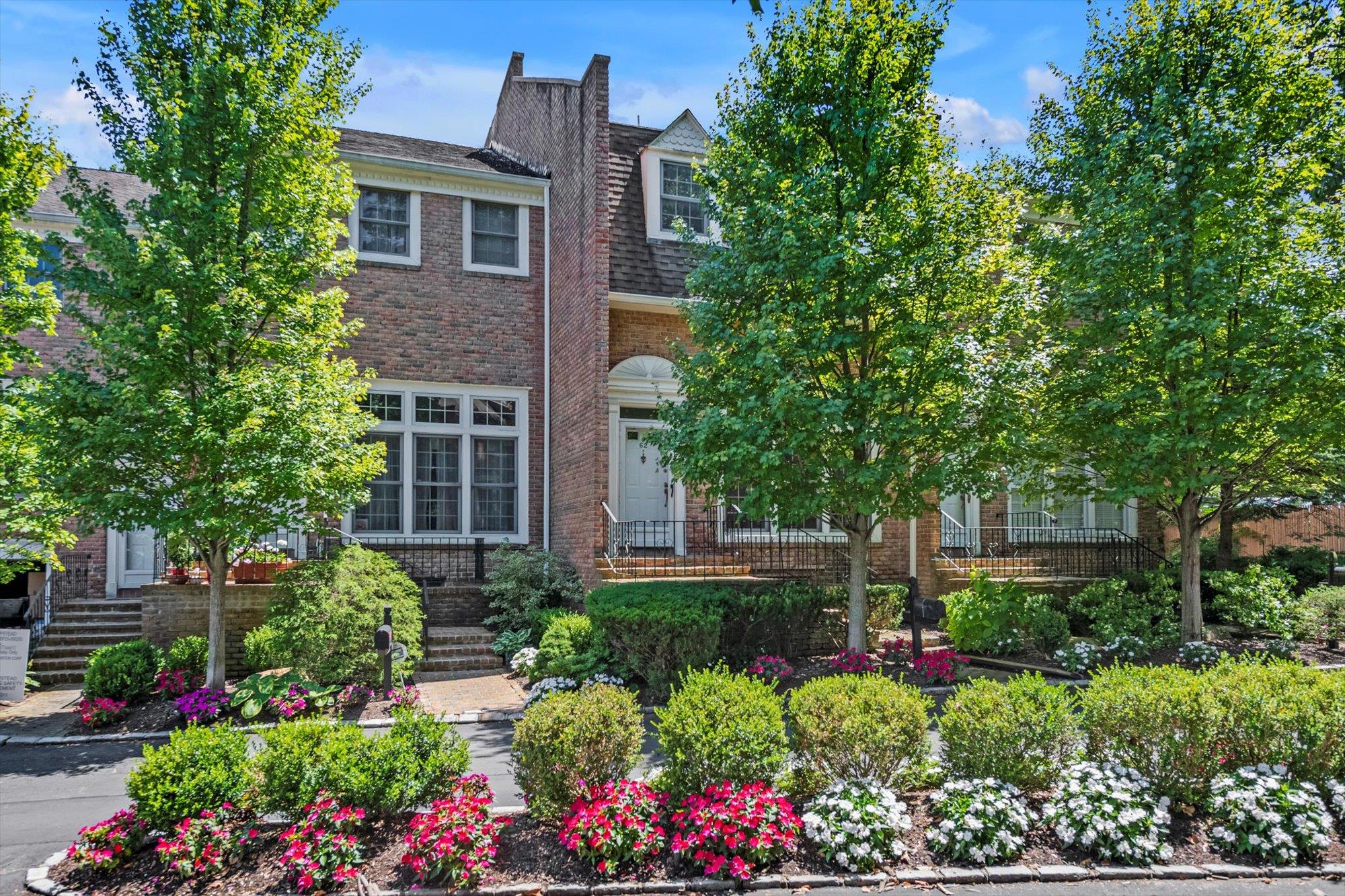 a view of a house with a yard and garden