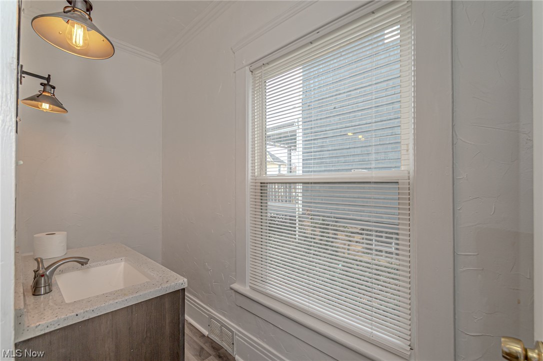 471 Rentschler Street Akron, OH 44304 - Photo 10 of 16 Bathroom with vanity and crown molding