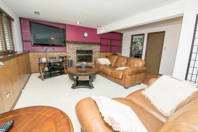 4 Wedgewood Road Matteson, IL 60443 - Photo 17 of 20 a living room with fireplace furniture and a flat screen tv