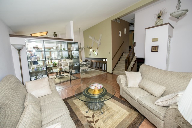 4 Wedgewood Road Matteson, IL 60443 - Photo 3 of 20 a living room with furniture and a floor to ceiling window