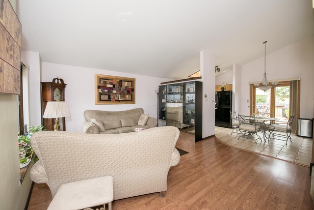 4 Wedgewood Road Matteson, IL 60443 - Photo 6 of 20 a living room with furniture a large window and wooden floor