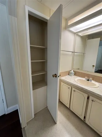 a bathroom with a double vanity sink and mirror