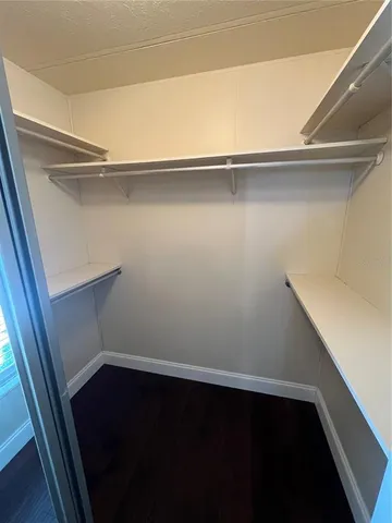 a view of an empty walk in closet