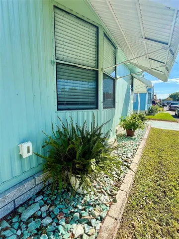 a potted plant sitting in front of a house