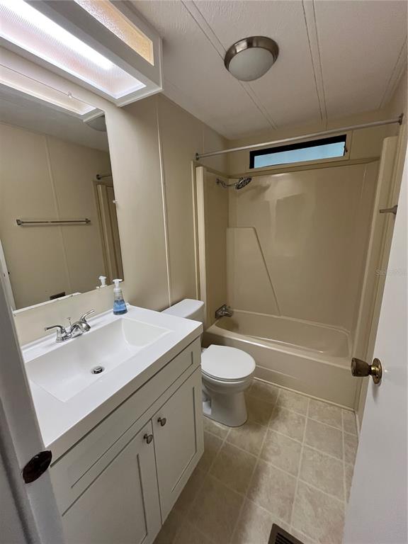 12100 Seminole Boulevard, Unit 365 Largo, FL 33778 - Photo 24 of 32 a bathroom with a sink a toilet and shower