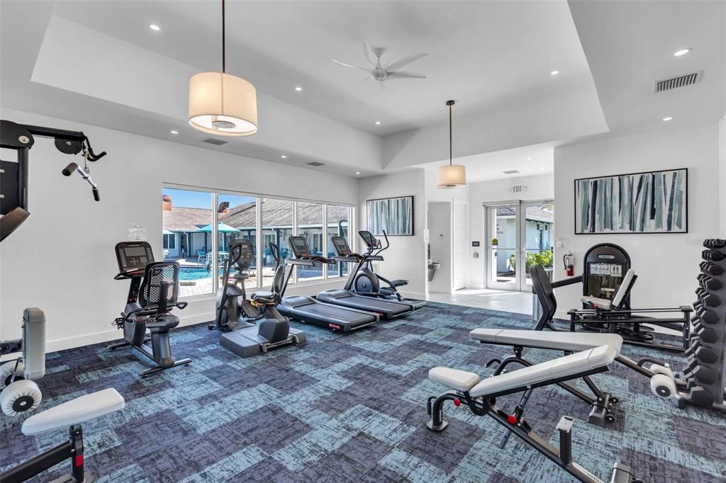 12100 Seminole Boulevard, Unit 365 Largo, FL 33778 - Photo 30 of 32 a living room with lots of furniture and a table