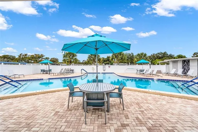 a view of a swimming pool with a patio