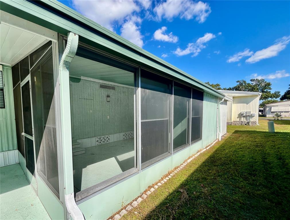 12100 Seminole Boulevard, Unit 365 Largo, FL 33778 - Photo 4 of 32 a view of backyard with large trees and plants