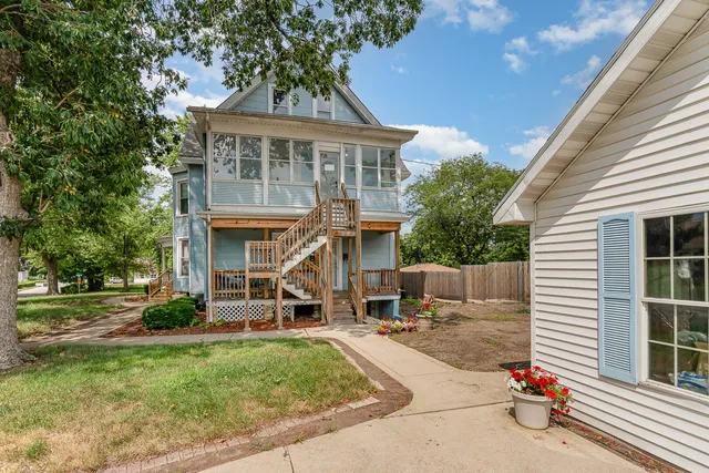 a view of house with outdoor seating area