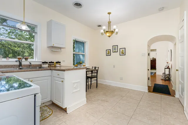 a kitchen with a refrigerator and a sink