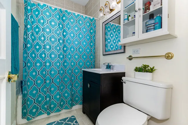 a bathroom with a toilet and sink