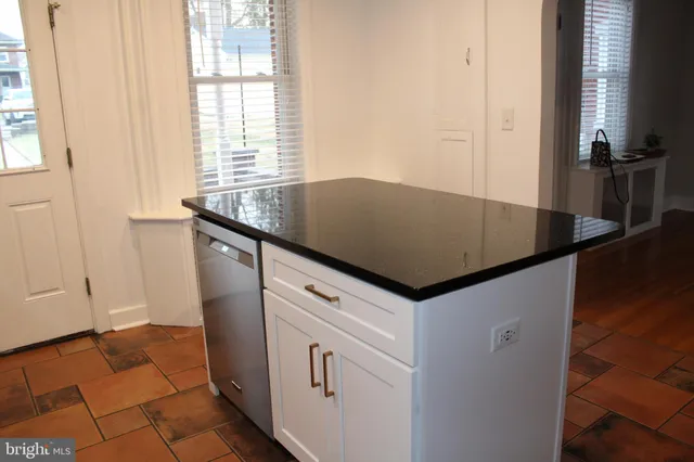 a kitchen with sink and window