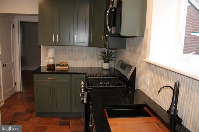 a kitchen with a sink and a window