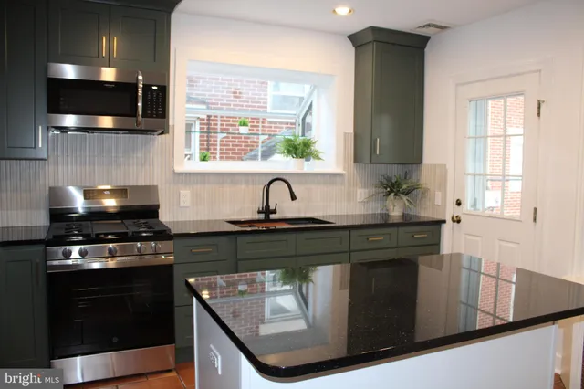 a bathroom with a toilet a sink and a window